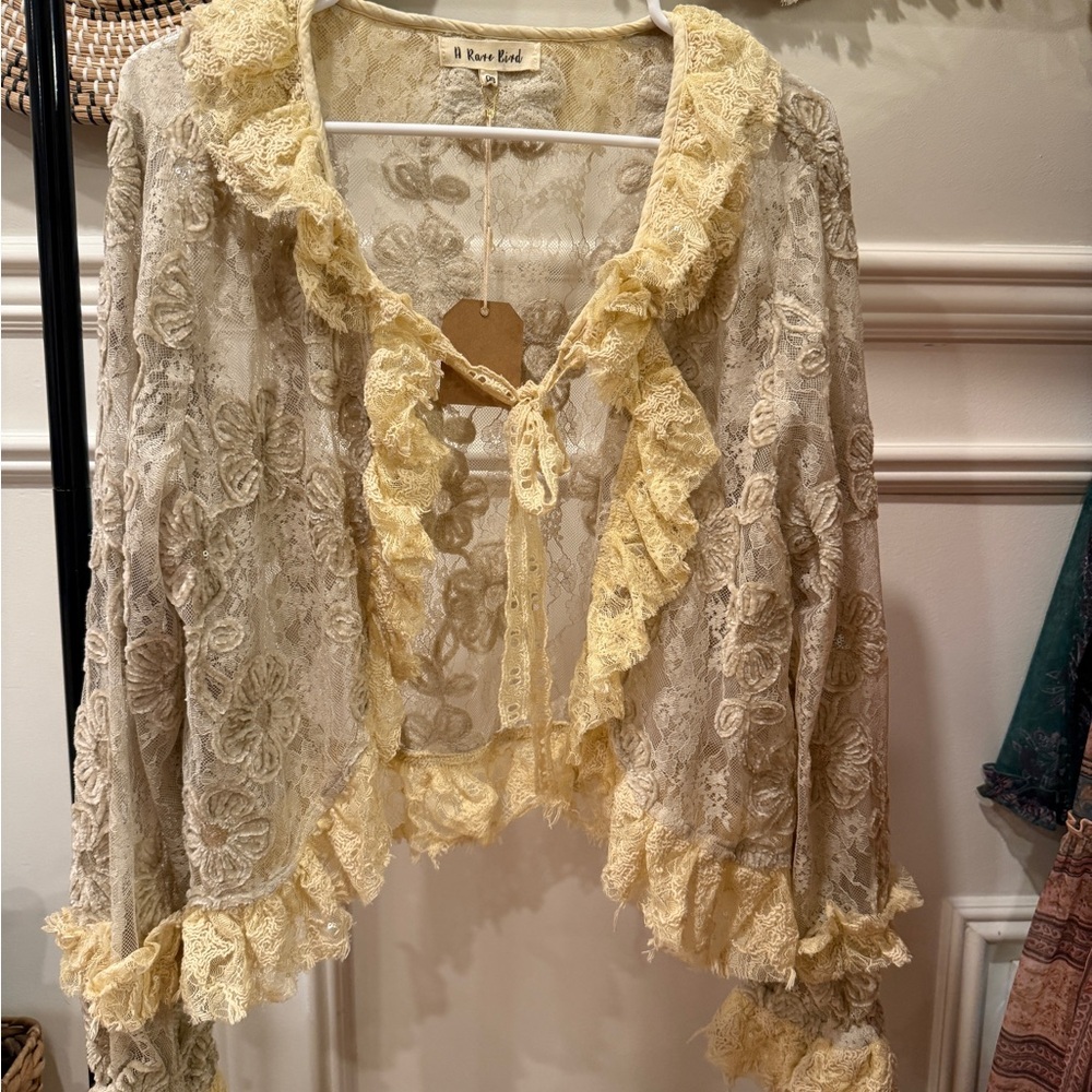 A Rare Bird Cream and Yellow Ruffled Tie Front Blouse